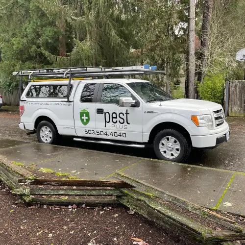 Pest Plus service truck parked alongside the street in Gresham OR
