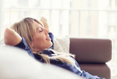 gresham woman relaxing at home knowing she has long-term cockroach prevention by Pest Plus